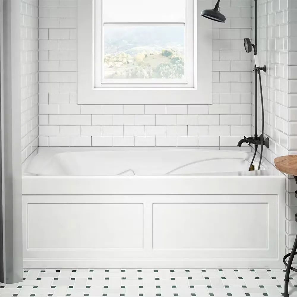 A combination white bathtub and shower in a bathroom with white subway tile walls and black fixtures.