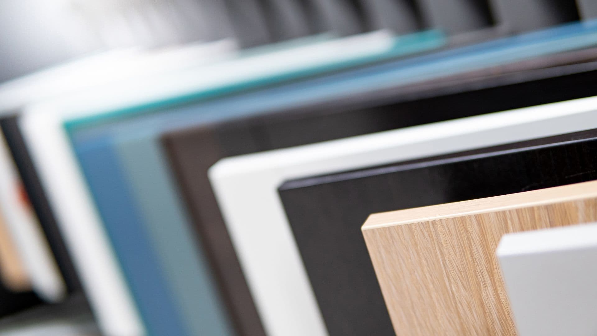 Sample cabinet materials in various colors and finishes.