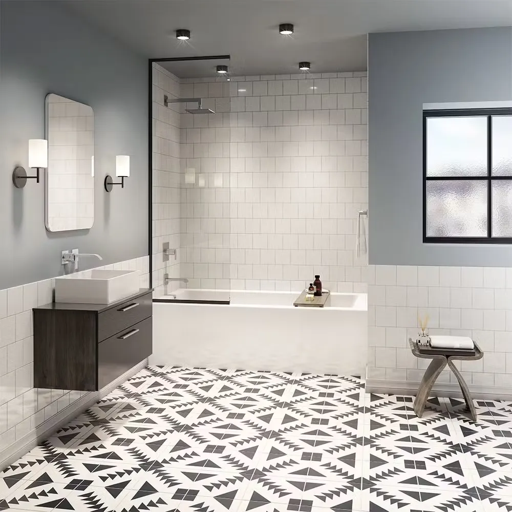 A gray bathroom with black and white geometric tile floor, combination shower bathtub with white tile walls and partial glass partition wall.